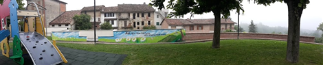 Il parco giochi Don Rubino di La Morra e il muro dipinto dall'artista Karim Cherif con i bambini